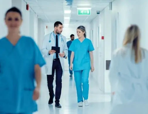 Healthcare providers in a hospital corridor setting