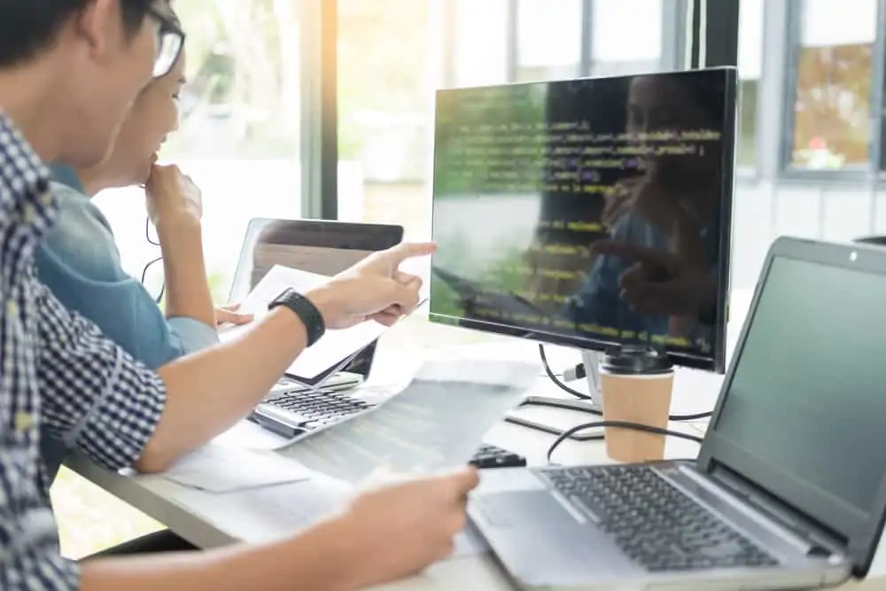 Legal team looking at a modern computer