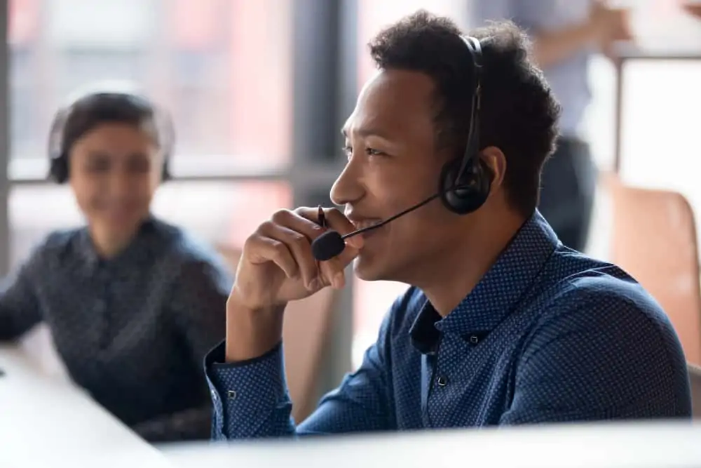 Employee talking on a headset to a legal team