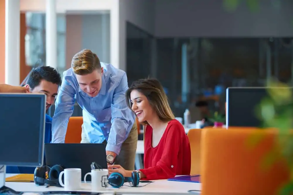 A group of people working together in an office environment
